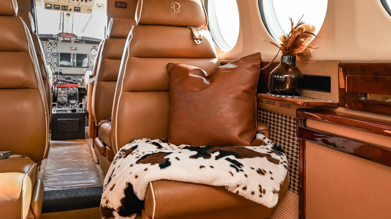 King Air cabin with tan leather club seating